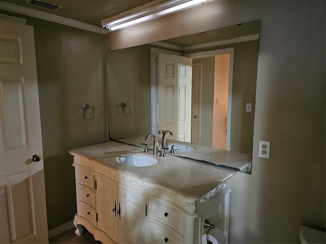 bathroom featuring vanity and ornamental molding