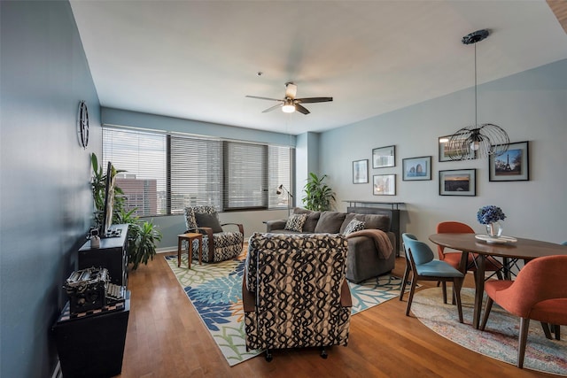 living room featuring ceiling fan and wood-type flooring