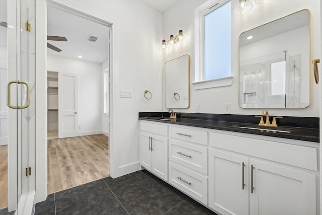 3703 Pilgrims Mews, Rowlett, TX 75088 - bathroom with a stall shower, double vanity, tile patterned flooring, ceiling fan, and recessed lighting