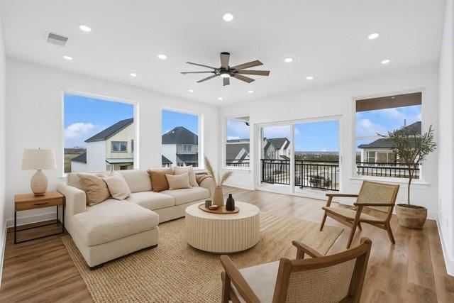 3703 Pilgrims Mews, Rowlett, TX 75088 - living room with ceiling fan, light wood-style flooring, and recessed lighting
