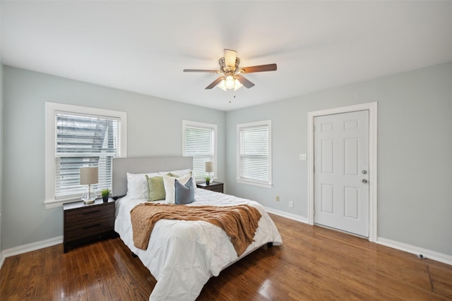 bedroom with dark wood-type flooring and ceiling fan