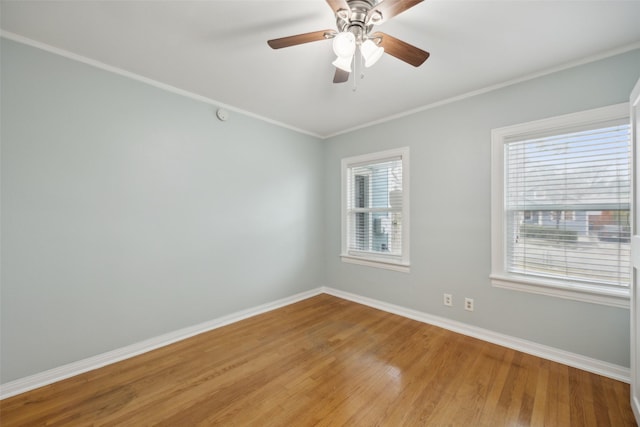 unfurnished room with crown molding, a wealth of natural light, ceiling fan, and light hardwood / wood-style flooring