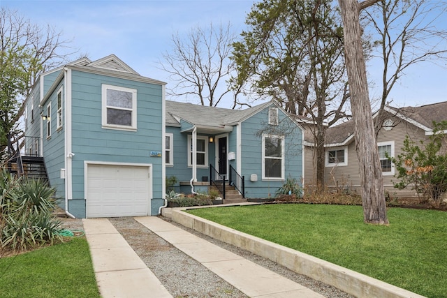 view of front of property featuring a garage and a front yard