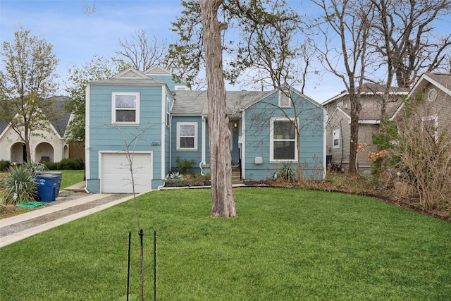 view of front of house featuring a garage and a front lawn