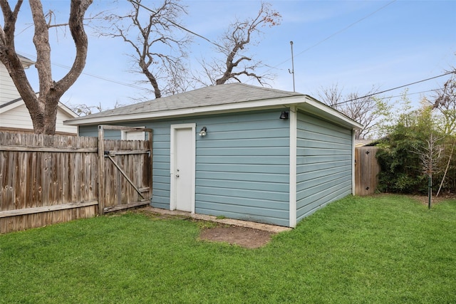 view of outbuilding with a yard