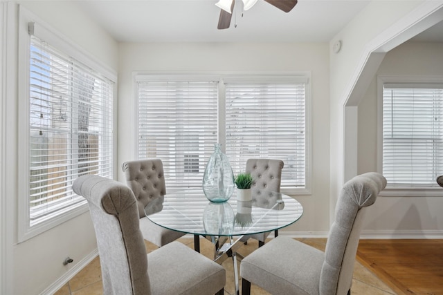 dining room featuring light tile patterned flooring and ceiling fan