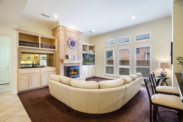 404 Twin Creeks Dr, Allen, TX 75013 - tiled living room with a brick fireplace, crown molding, recessed lighting, and built in features