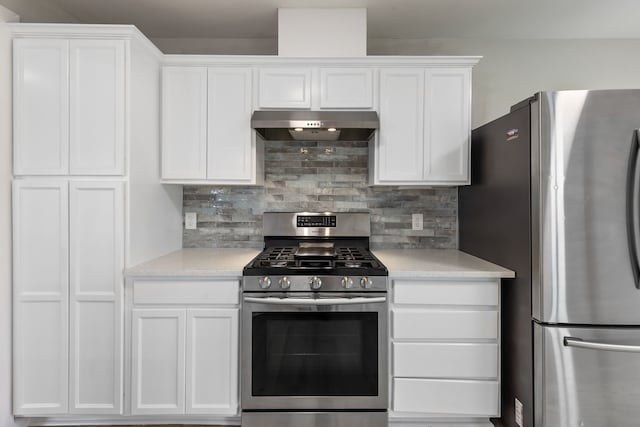 kitchen featuring white cabinetry, decorative backsplash, and appliances with stainless steel finishes