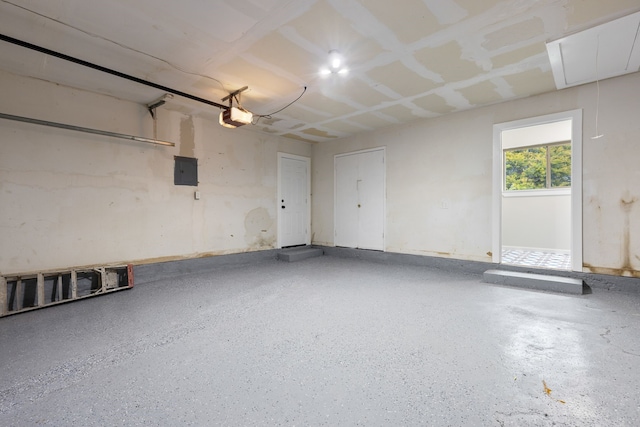 garage featuring a garage door opener and electric panel