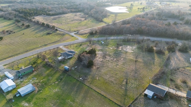 birds eye view of property featuring a rural view