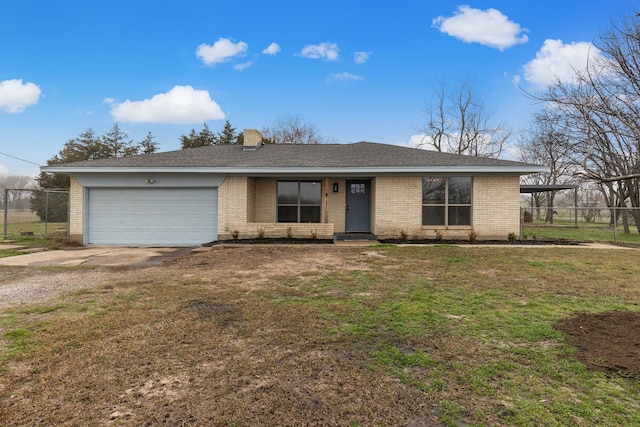 ranch-style home with a garage and a front lawn