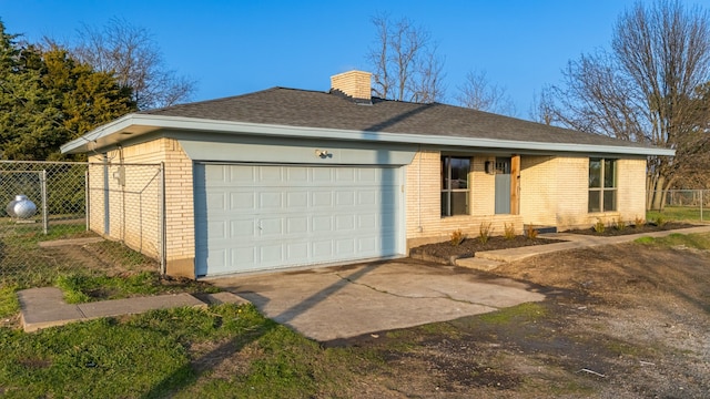 single story home featuring a garage