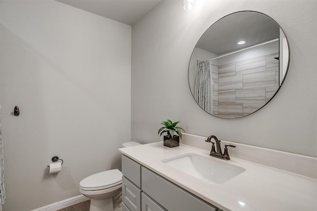 bathroom featuring vanity, toilet, and a shower with shower curtain