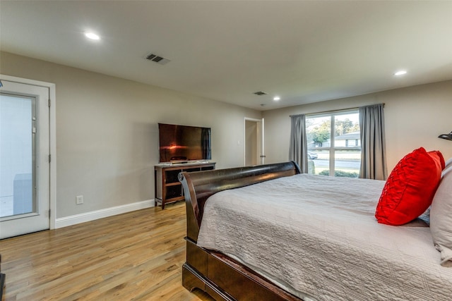 bedroom with baseboards, recessed lighting, visible vents, and light wood-style floors