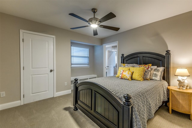 bedroom with light carpet, ceiling fan, and baseboards