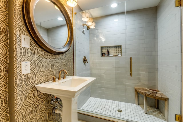 bathroom featuring a tile shower and recessed lighting