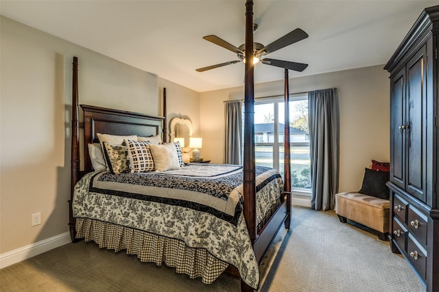 carpeted bedroom featuring a ceiling fan and baseboards