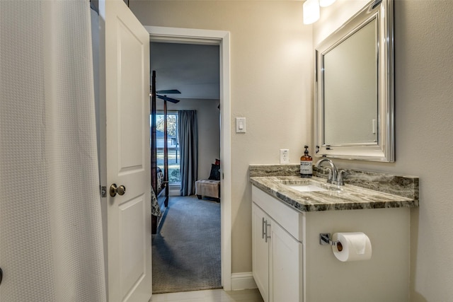 full bathroom featuring ceiling fan and vanity