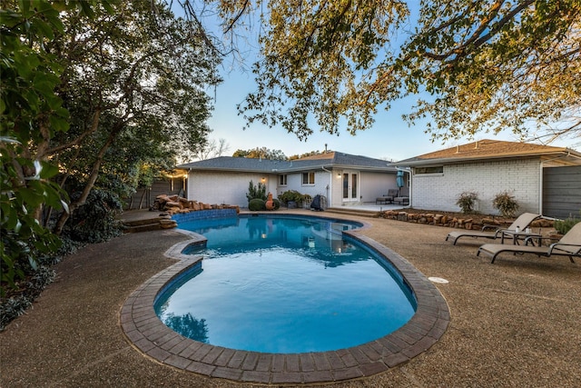 pool featuring a patio area