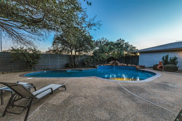 view of swimming pool with a patio area, a fenced backyard, and a fenced in pool