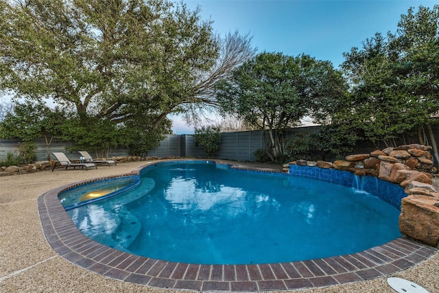 view of pool featuring a fenced in pool, a patio area, and a fenced backyard