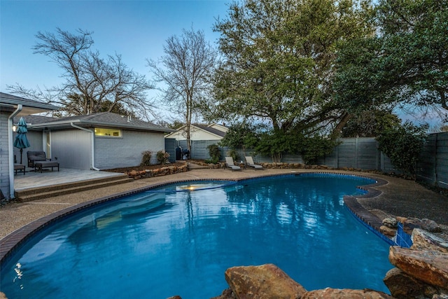 view of pool with a patio area, a fenced backyard, and a fenced in pool