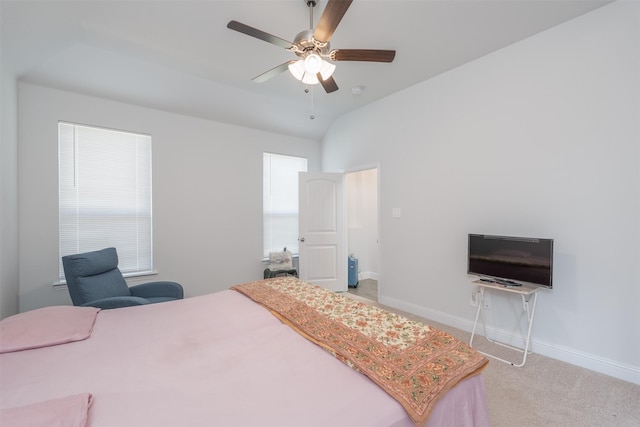 bedroom featuring vaulted ceiling, light colored carpet, and ceiling fan