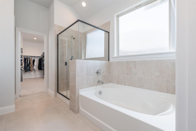 bathroom featuring tile patterned floors and plus walk in shower