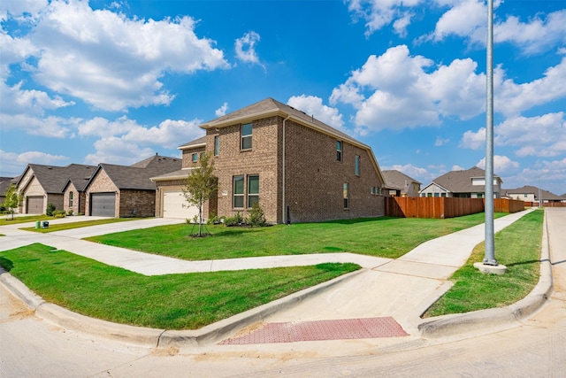 view of front of house with a garage and a front lawn