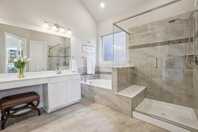 bathroom with tile patterned floors, lofted ceiling, plus walk in shower, and vanity