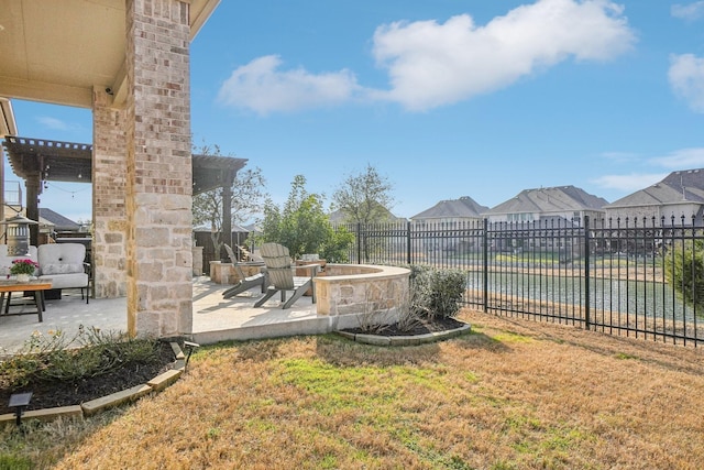 view of yard with a patio and a fire pit