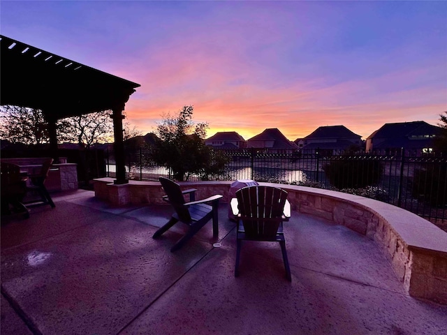 view of patio terrace at dusk