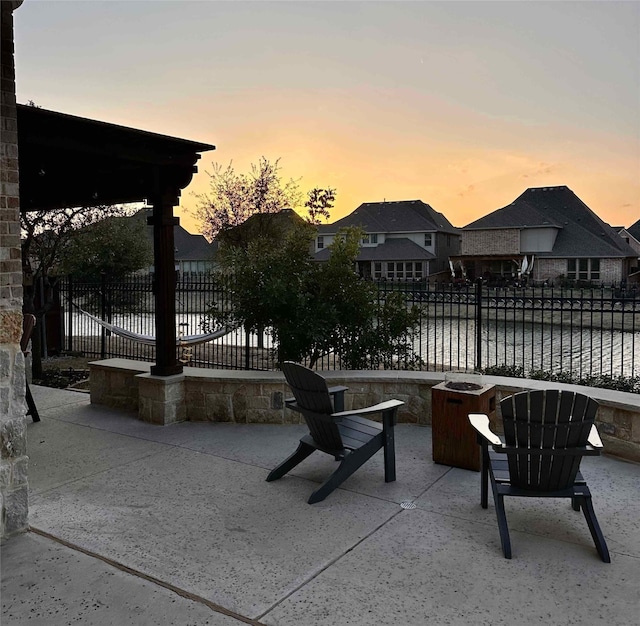 patio terrace at dusk with a water view