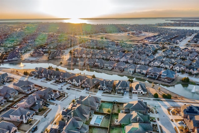 aerial view at dusk with a water view