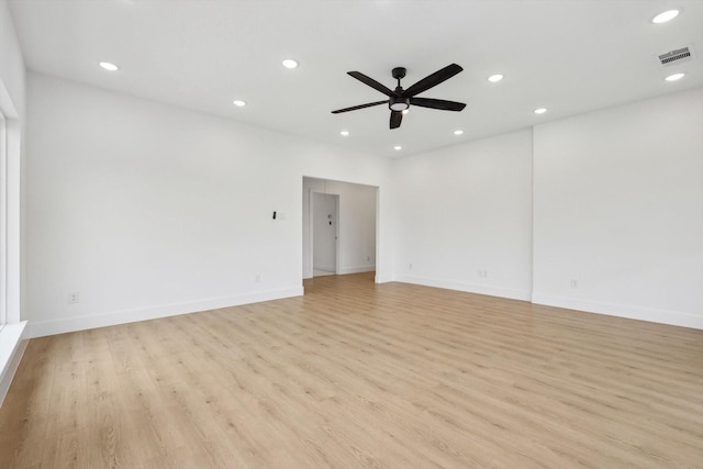 unfurnished room with ceiling fan and light hardwood / wood-style floors