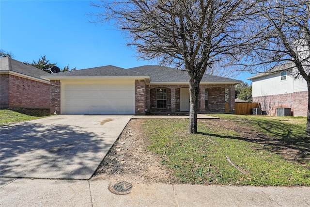 ranch-style home featuring a garage and a front lawn