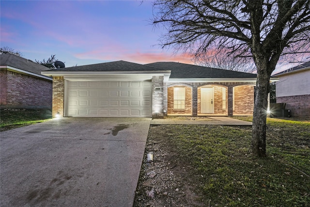 ranch-style house featuring a garage