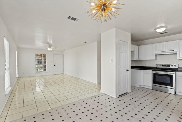 kitchen with white cabinetry, ceiling fan with notable chandelier, stainless steel range with electric cooktop, and light tile patterned floors