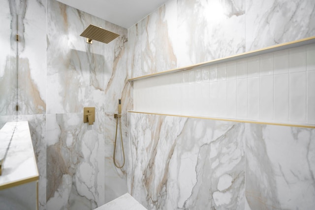 full bath featuring a marble finish shower