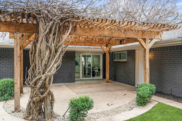 exterior space with an attached carport and a pergola