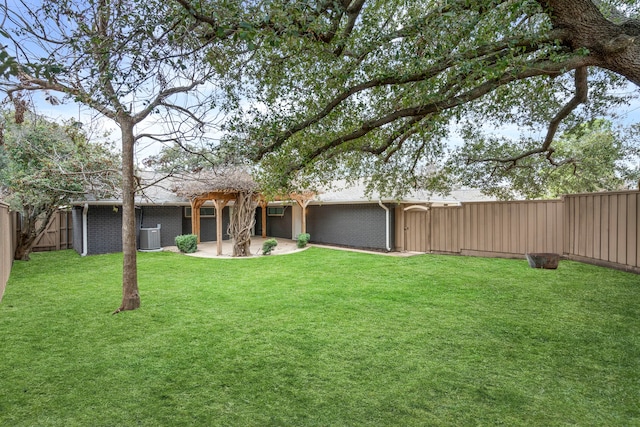 view of yard with a patio area and a fenced backyard