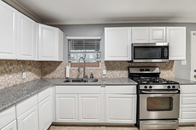 kitchen with crown molding, stainless steel appliances, sink, and white cabinets