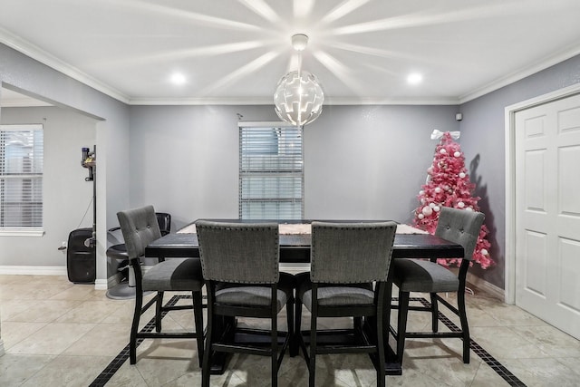 dining space featuring a notable chandelier, light tile patterned floors, and ornamental molding