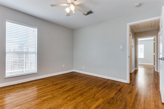 spare room featuring hardwood / wood-style flooring and ceiling fan