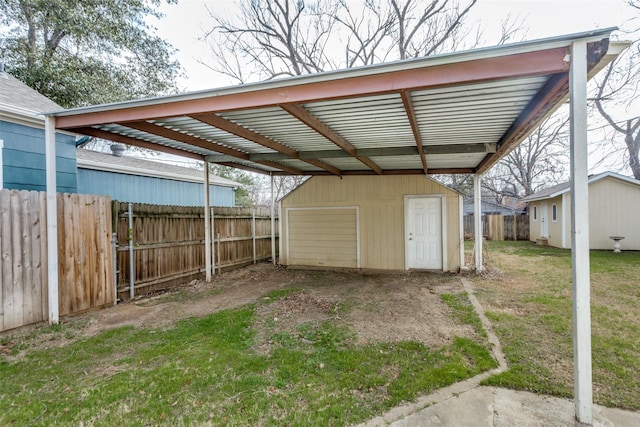 view of outbuilding with a garage and a lawn