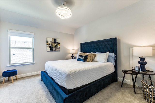 bedroom featuring light carpet