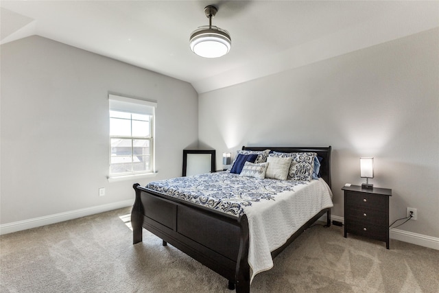 carpeted bedroom featuring lofted ceiling