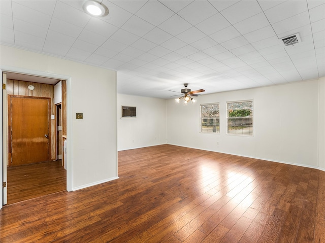 empty room with dark wood-type flooring and ceiling fan