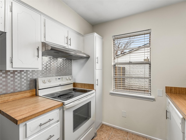 kitchen with white cabinetry, white electric range, light tile patterned flooring, and backsplash