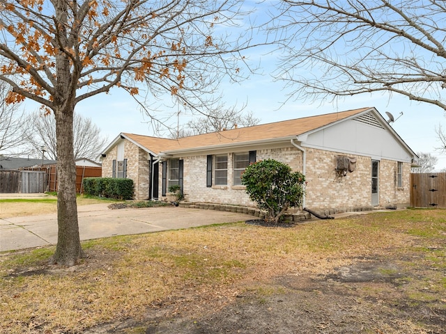 ranch-style home with a front lawn